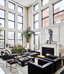 living room with a black leather sofa
