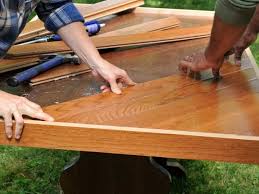 Start by making the first plank flush with the edge of the plywood, that way you can add the front piece later and make the countertop look like a solid hunk of wood. How To Makeover A Dining Room Table With Hardwood Flooring Diy