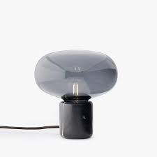 This soothing lamp combines the soft curves of glass with the stability of black marquina or smoked oak. New Works Karl Johan Table Lamp Black Marquina House For Goodies Limited
