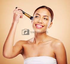 makeup brush and woman with cosmetic