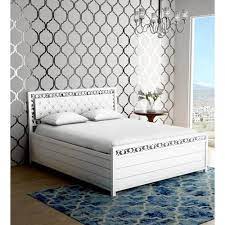 white wooden queen size storage bed