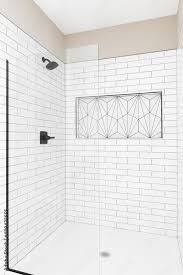 A Renovated Shower With White Subway