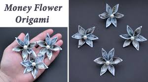 Take the long, top edge of the cellophane and roll it around the candy, forming a tube. Easy Money Double Flower Lei Idea For Graduation Origami Dollar Tutorial Diy By Nprokuda Youtube