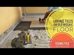 old mosaic floor with tile adhesive