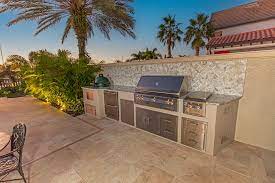 custom outdoor kitchen and wet bar in