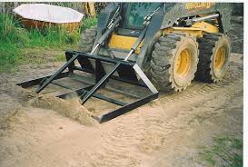 custom built skid steer attachments to