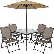 Patio Umbrella With Chairs And Table At