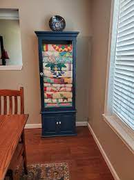 quilt cabinet made from gun cabinet