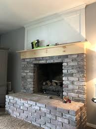 brick fireplace makeover with shiplap
