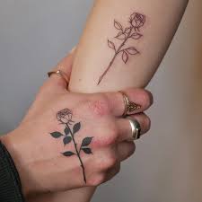 25 bold and beautiful rose hand tattoos
