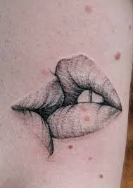kiss tattoo meaning the deeper