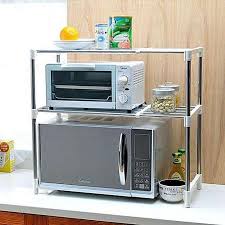 a toaster oven on top of a microwave