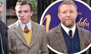 Rocco Ritchie emulates dad Guy's style as he steps out wearing a retro suit  in London | Daily Mail Online