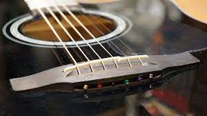 how to lower acoustic guitar strings