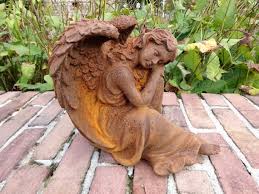 Old Garden Sculpture Of An Angel