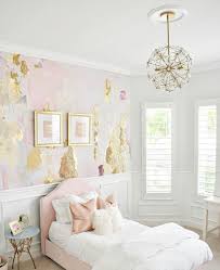 pink and gold s room accent wall