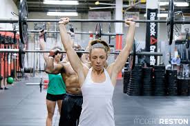 middle aged mom walks into crossfit reston