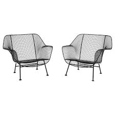 pair of woodard sculptura patio chairs