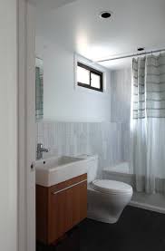 If space permits, two sink areas provide great convenience in shared bathrooms. New York Shower Curtains Jcpenney Modern Bathroom With Tile Wainscoting And Mirror Door Dealers