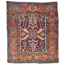 antique heriz rug with large leaves