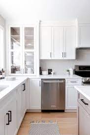 28 white cabinets with black hardware