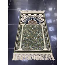 green prayer rug inspired by the carpet