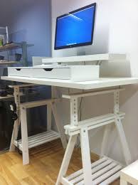 It sits on top of your desk and but if you're looking for a simple (and affordable) standing desk converter, we have a few ideas for you. 15 Super Clever Ikea Desk Hacks Craftsy Hacks