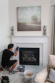 tile over a marble fireplace surround