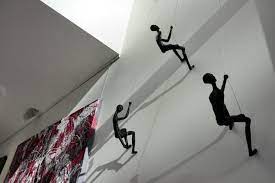 climbing man wall sculpture for
