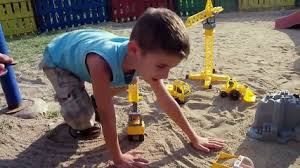 Image result for children playing with toy cars and trucks 