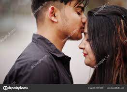 indian couple posed outdoor kissing
