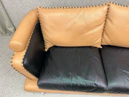 modern italian two seater sofa in tan
