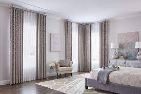 hang curtains over vertical blinds a