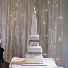 This grand tower, excluding the top layer, serves 200. Eiffel Tower Wedding Cake