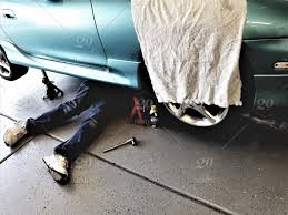We don't just set the bar, we keep pushing it higher! Auto Mechanics A Man Doing His Own Auto Repair Is Underneath The Car Under The Car Legs Seen Protruding From Beneath The Car Stock Photo 1213d955 E3ca 4258 A5f9 39d05f23298f