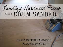 sanding hardwood floors with a drum