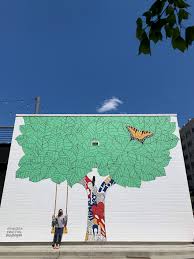 kelsey montague completes mural at