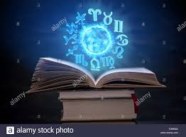 Open Book On Astrology On A Dark Background The Glowing