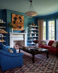 red velvet sofa with blue accent chairs