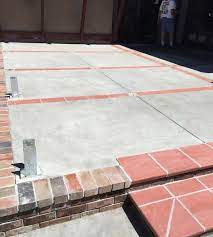 Concrete Patio With Brick Ribbon