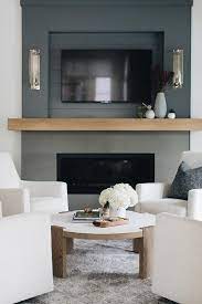 Black Fireplace With Tan Wood Mantel