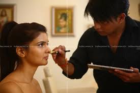 model getting her wedding makeup