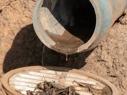 main drainpipe cleanout using an auger