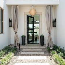 Glass Front Door Accented With Curtains