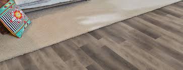The carpet is then rolled out over the floor, stretched, and attached around the perimeter by hooking the carpet onto the tack strips. Flooring Carpeting Vinyl Laminate Flooring Phenix Flooring