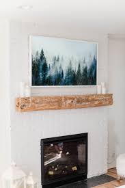 A tv mount can easily be attached to the wall above the fireplace. How To Make The Samsung Frame Tv Look Like Art Lauren Mcbride