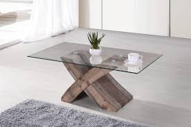 The one disadvantage of having a glass top coffee table is that it tends to break easily compared to metal or wood coffee table tops. Elden Rustic Brown Wood Coffee Table W Tempered Glass Top By Casamode Functional Furniture