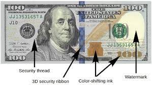 how to tell if a 100 dollar bill is real