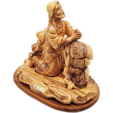 olive wood carving praying in