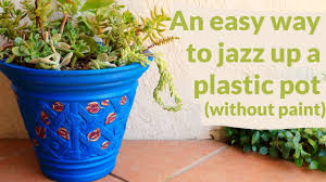 jazz up a plain plastic flower pot